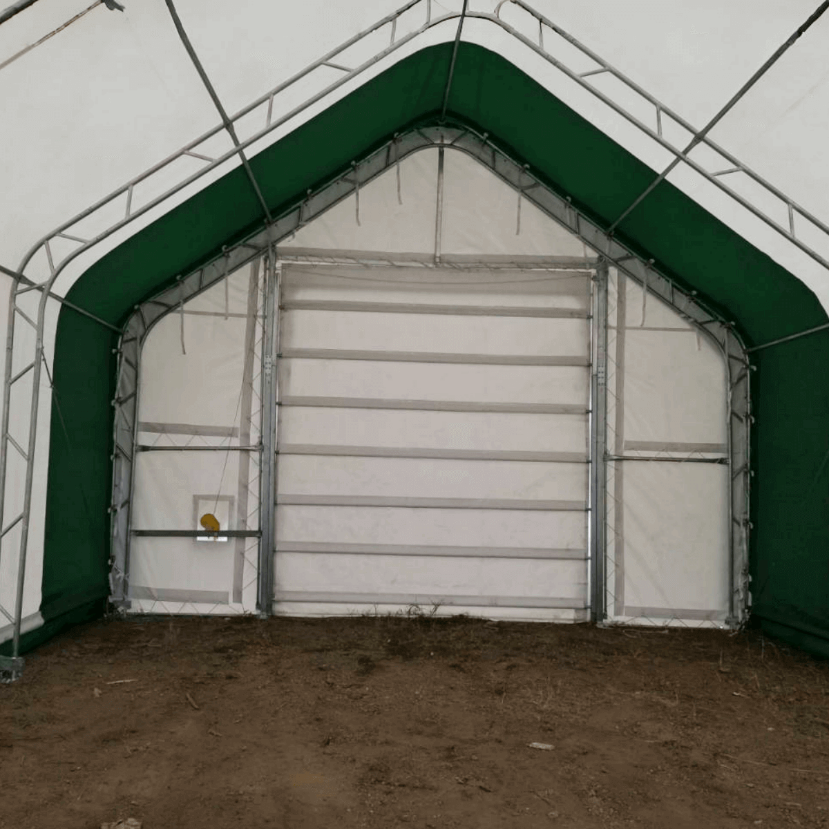 Gold Mountain storage shelter with green frame and white cover, roll-up door